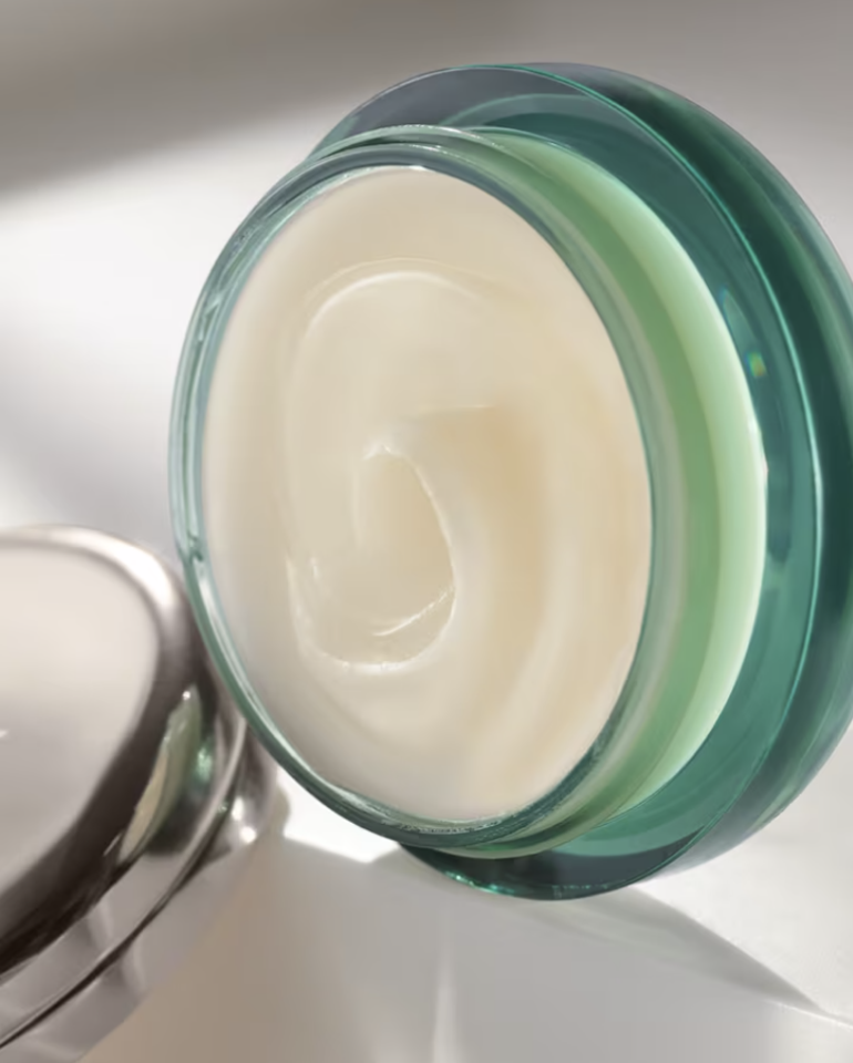 Photograph of the Lip Balm pot open with view if balm inside.