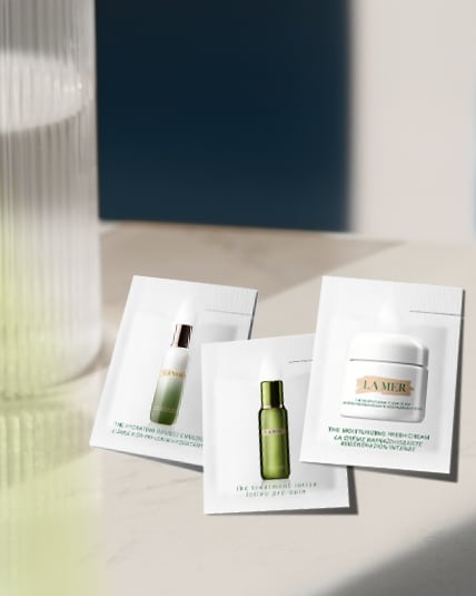 Photograph of three la mer sample sachets on a benchtop.